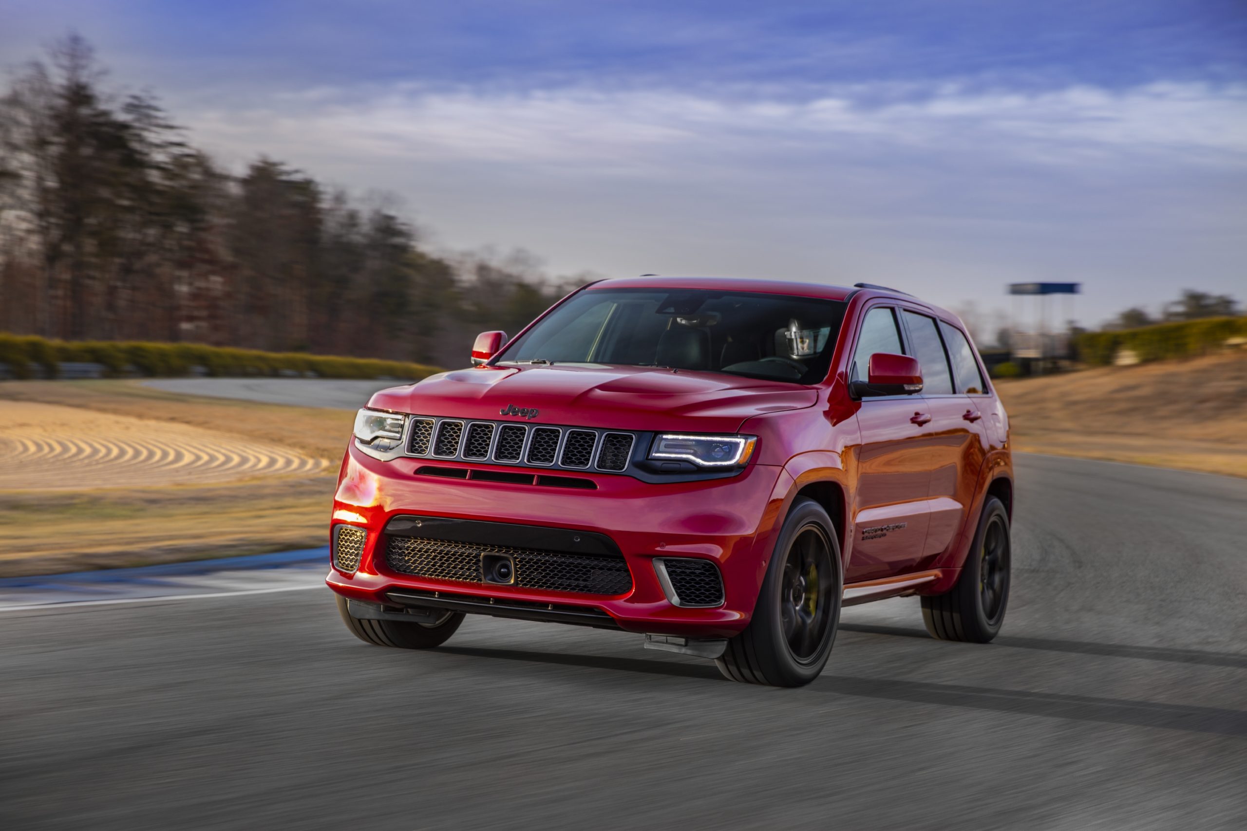 Red 2021 Jeep Grand Cherokee Trackhawk on the race track