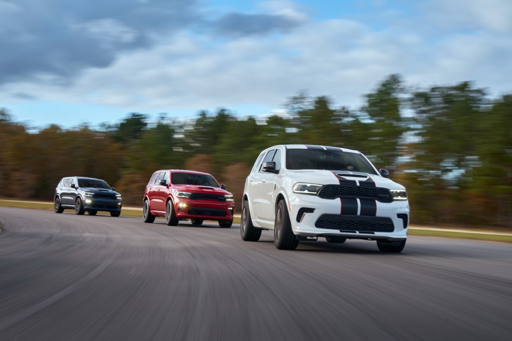 A row of SUVs including two 2021 Dodge Durango SRT Hellcats on the track | Stellantis