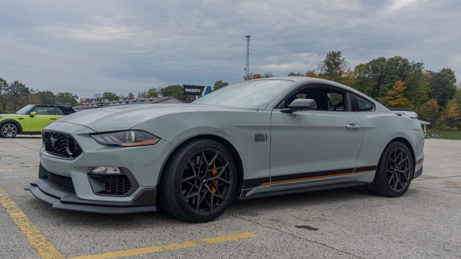 The front 3/4 view of a gray-and-black 2021 Ford Mustang Mach 1 with Handling Package at Road America