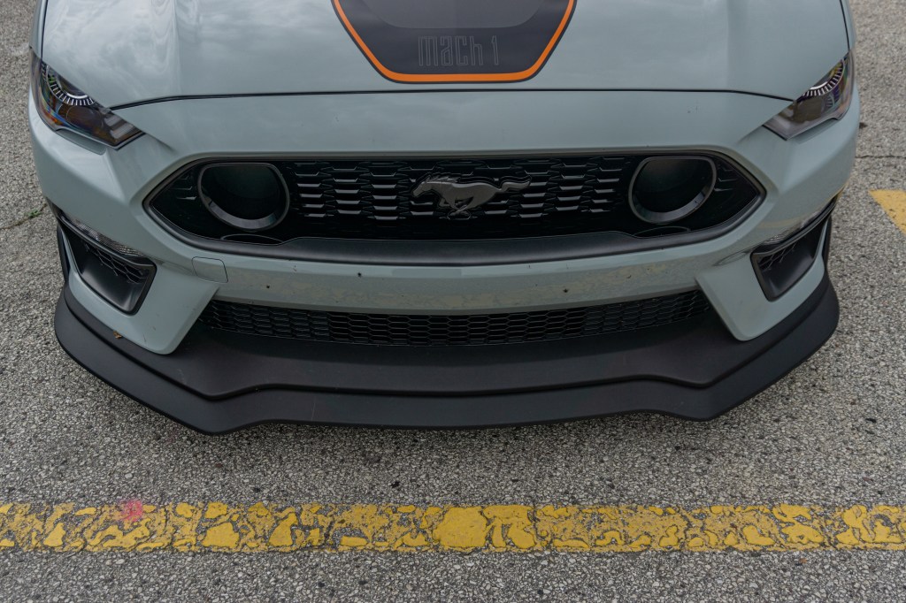 The front splitter and grille on a gray-and-black 2021 Ford Mustang Mach 1 with Handling Package at Road America
