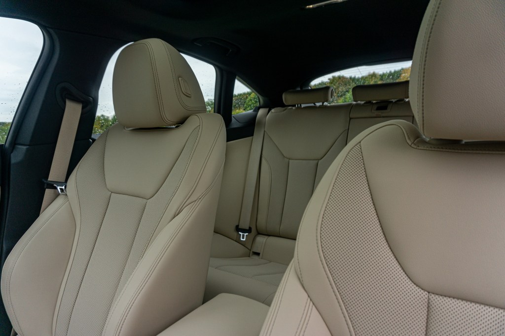 The tan-leatherette seats of a 2022 BMW M440i xDrive Gran Coupe seen from the front