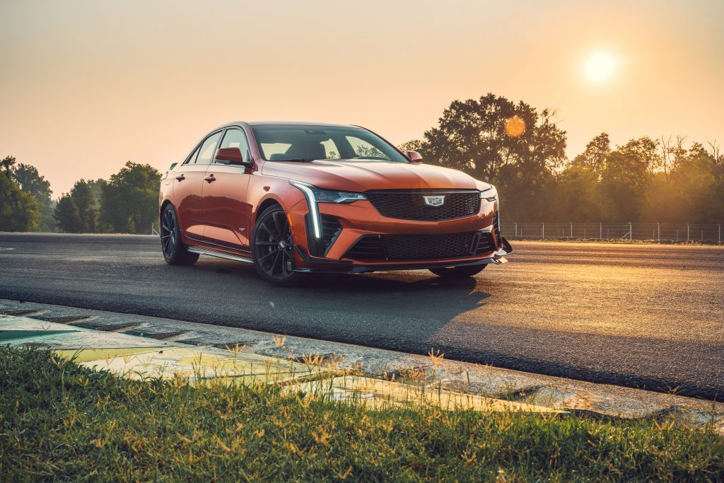 An orange 2022 Cadillac CT4-V Blackwing with optional Carbon Packages on a racetrack