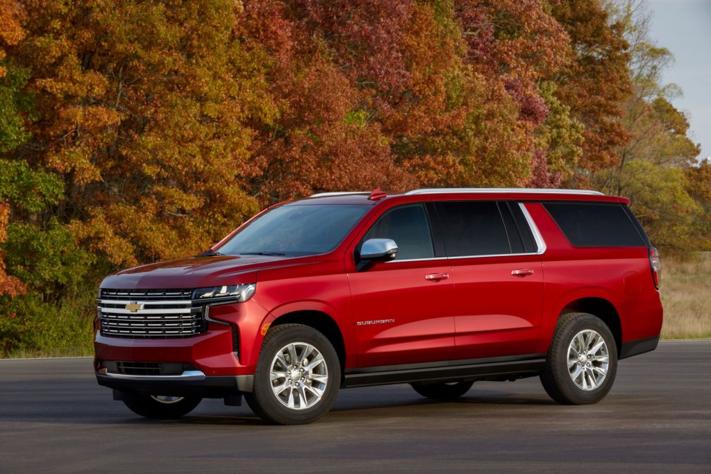 An optional 2022 Chevrolet Suburban in red paint color and a Duramax Turbo-Diesel powertrain is one of the SUVs with the best towing capacity on the market.