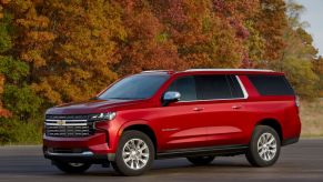 A 2022 Chevrolet Suburban in red paint color option and a Duramax Turbo-Diesel powertrain is one of the SUVS with the best towing capacity on the market.