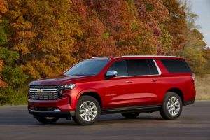 A 2022 Chevrolet Suburban Premier full-size SUV with a red paint color option and a Duramax Turbo-Diesel powertrain