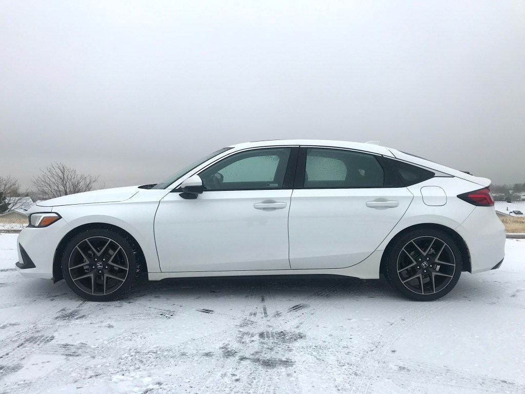 2022 Honda Civic Sport Touring side view in a snowy parking lot