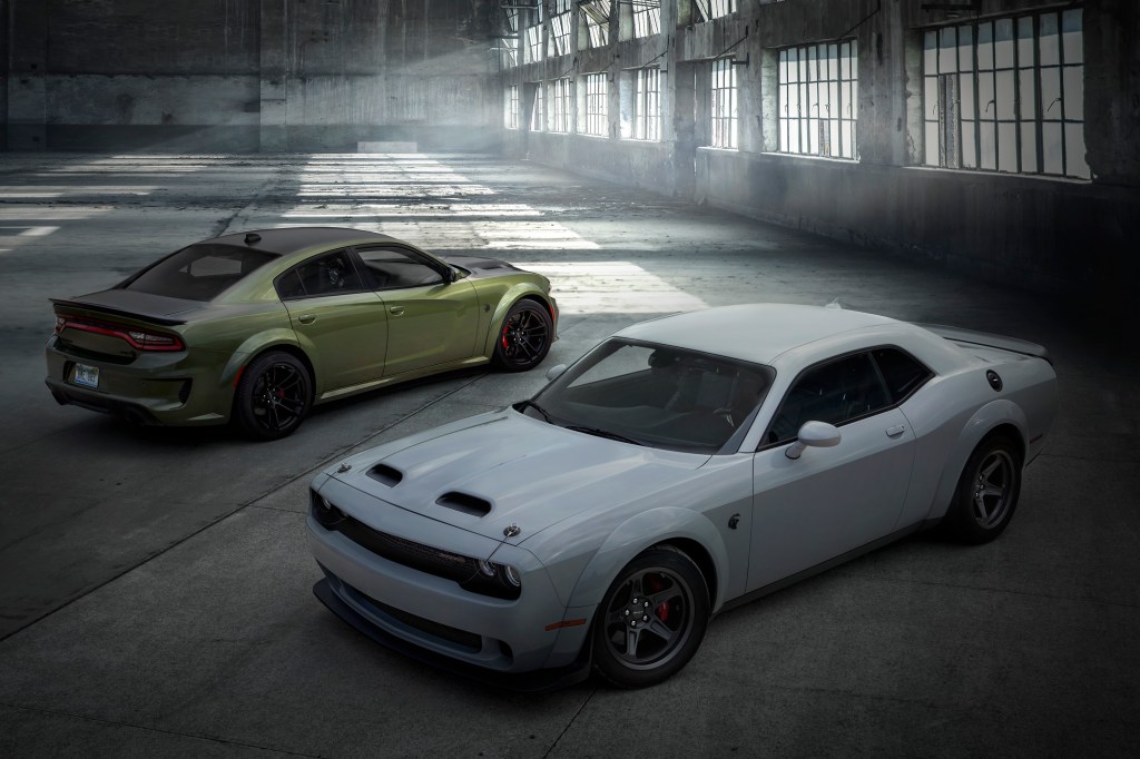 The 2022 Dodge Challenger and Charger are excellent examples of the best V8 sports cars out there, shot here in a warehouse