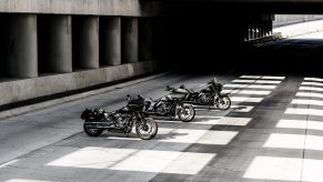A black 2022 Harley-Davidson Low Rider ST behind a gray Road Glide ST behind a black Street Glide ST