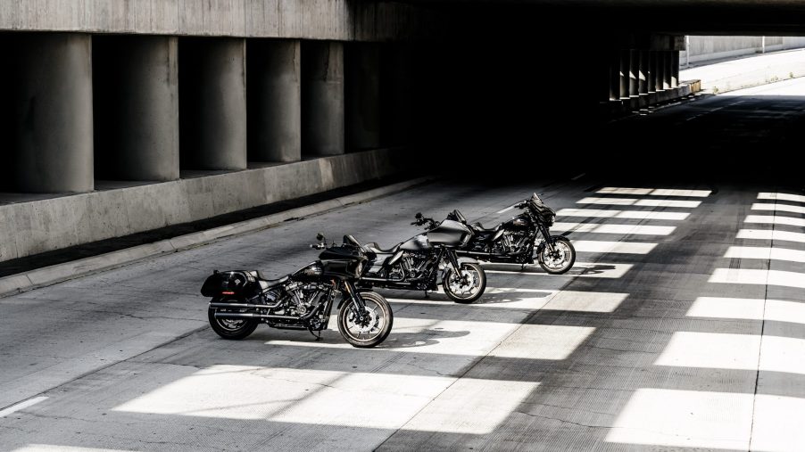 A black 2022 Harley-Davidson Low Rider ST behind a gray Road Glide ST behind a black Street Glide ST