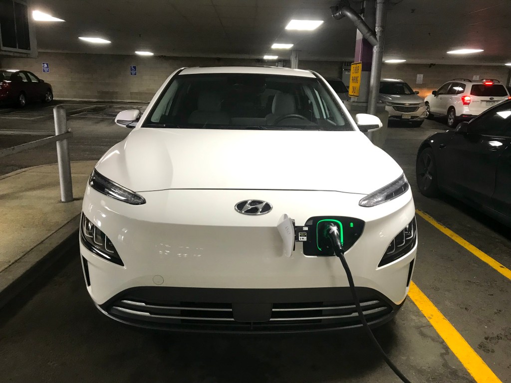 2022 Hyundai Kona Electric charging in a parking garage 
