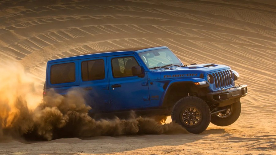 A blue 2022 Jeep Wrangler Rubicon 392 driving through the desert.