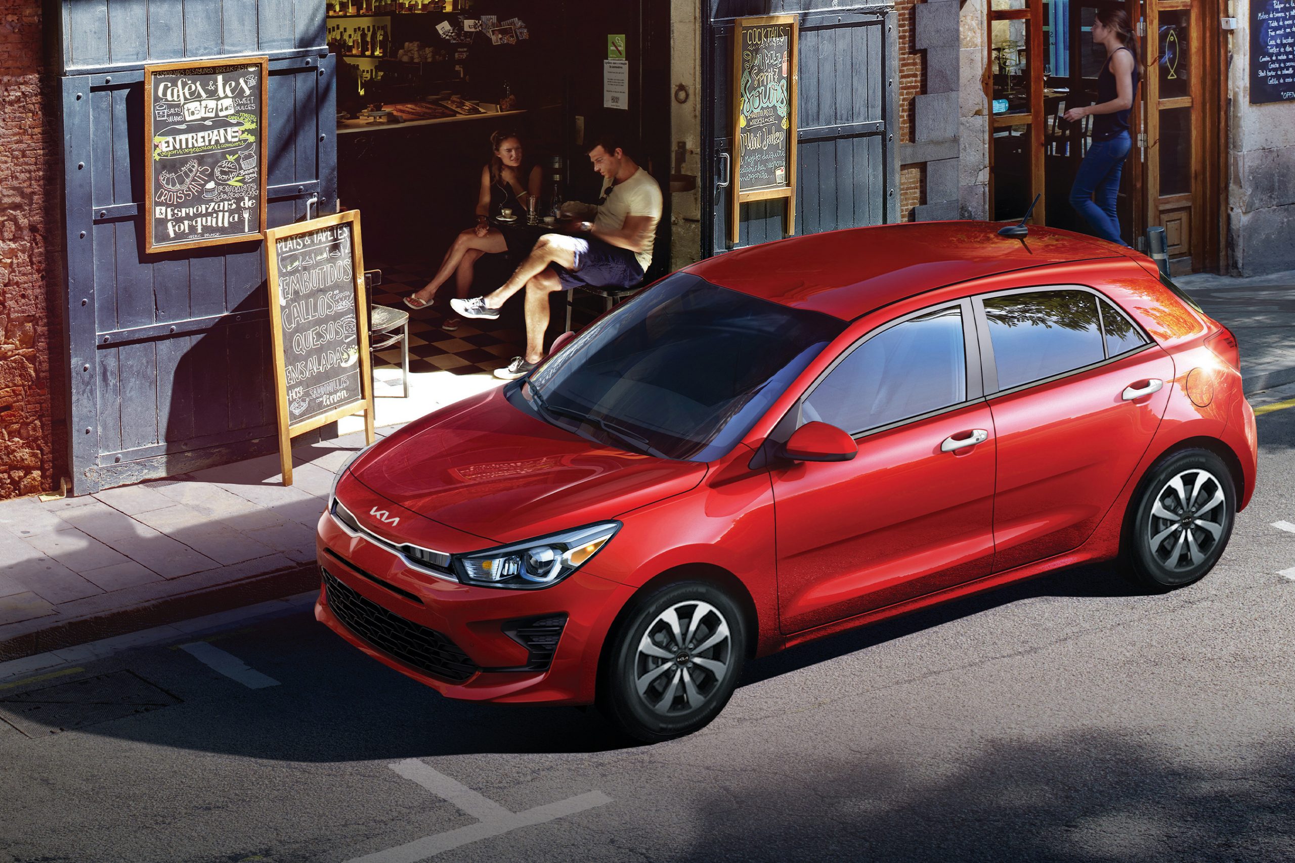 A red 2022 Kia Rio, one of the worst new car deals, shot from the front 3/4