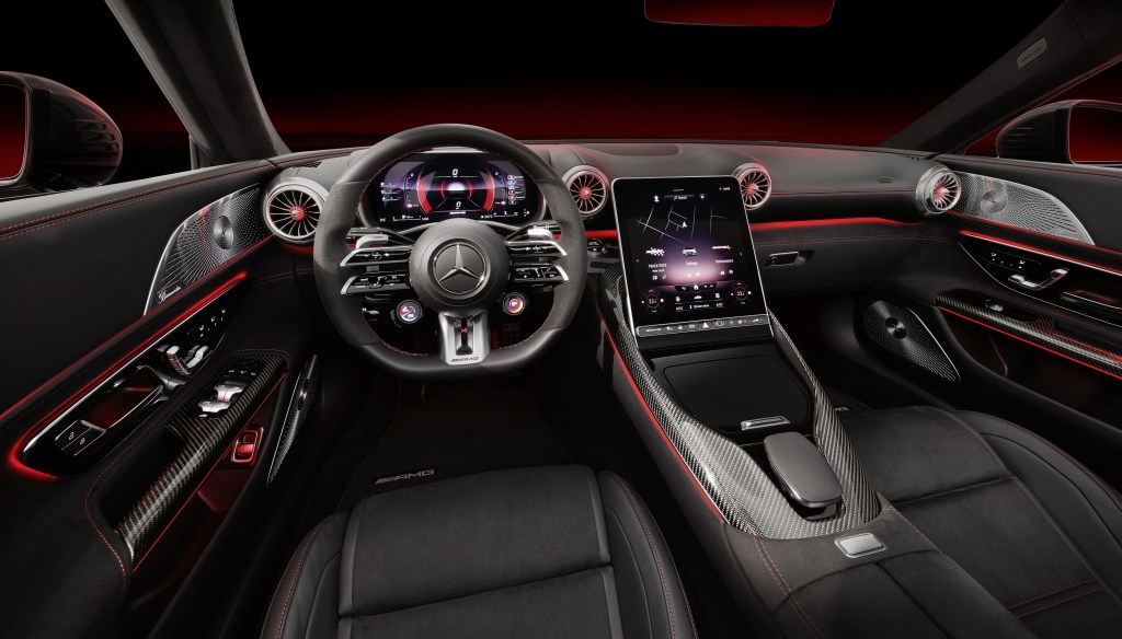 The black-leather-upholstered seats and black-red-and-carbon-fiber dashboard in a 2022 Mercedes-AMG SL 63
