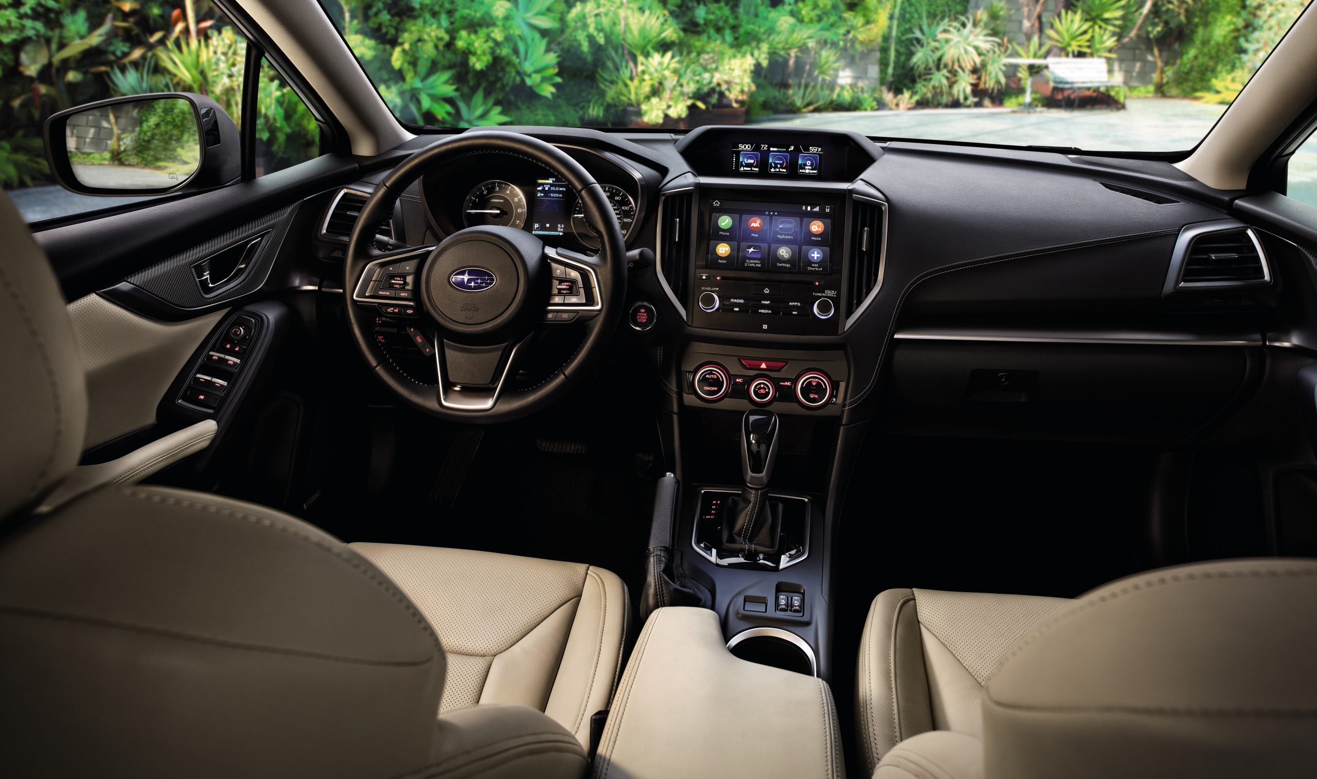 The interior of the new Subaru Impreza with tan leather seats