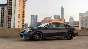 A black 2022 Toyota Camry shot in profile
