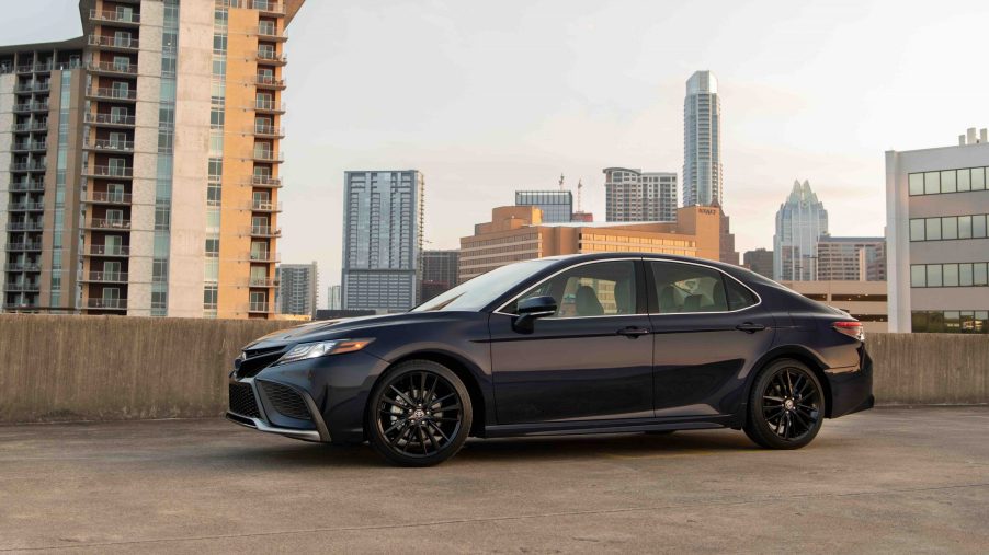 A black 2022 Toyota Camry shot in profile