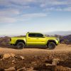 A lime green 2022 Toyota Tacoma TRD Pro parked on gravel overlooking mountains