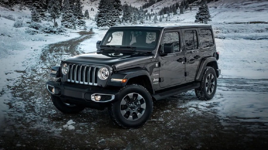 A black 2022 Jeep Wrangler in the snow.