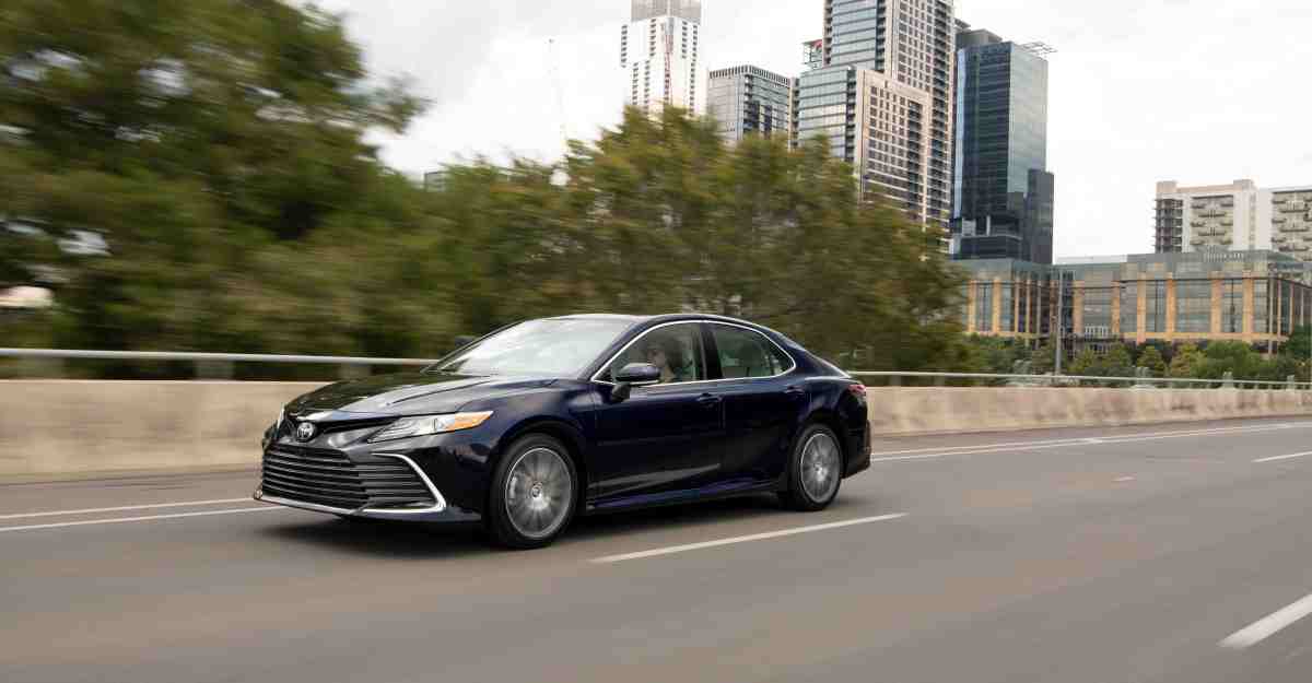 A 3/4 front view of the 2022 Toyota Camry in dark blue.