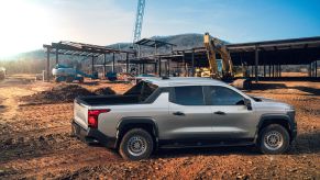 The 2024 Chevy Silverado WT (Work Truck) electric (EV) pickup truck model parked at a construction site