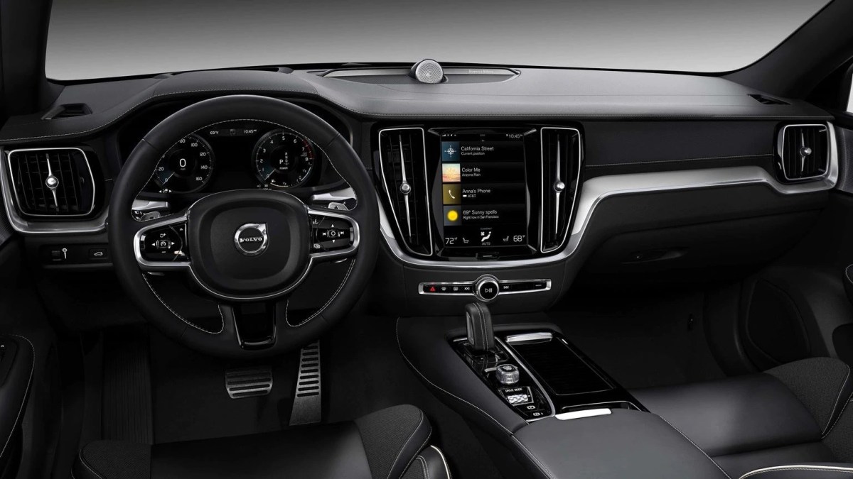 An interior view of the Volvo V60 showing the steering wheel, dashboard, and infotainment system