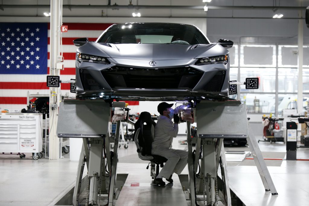 A PMC engineer works on the Acura NSX Type S