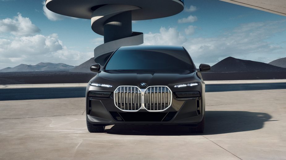 A rendering of a black 2023 BMW 7 Series sedan with illuminated grille option and split headlights.
