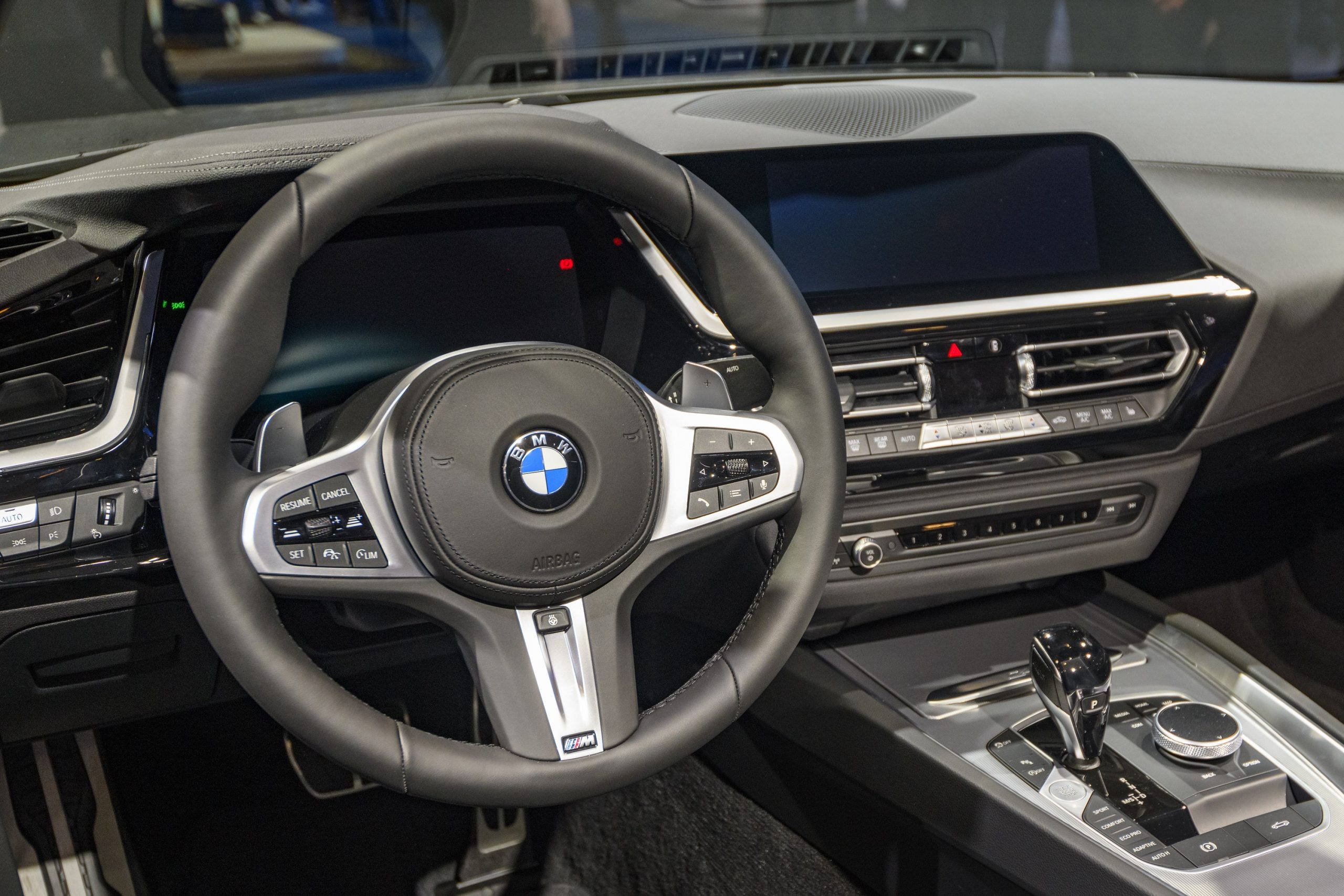 A new BMW interior with black leather and chrome accents