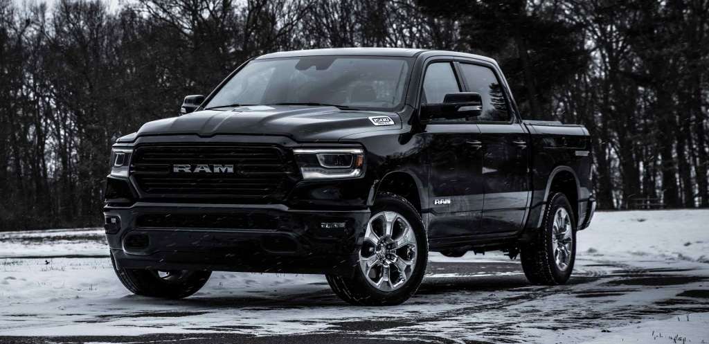 Black 2022 Ram 1500, which offers a deal to save money in Winter 2022, according to U.S. News, parked on snowy road