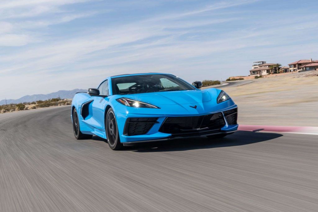 Blue 2022 Chevy Corvette Stingray, the Consumer Reports most satifying car, driving on a racetrack