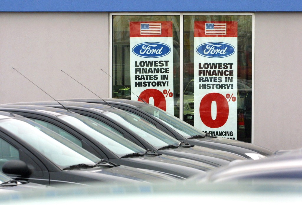  Unsold vehicles and zero-percent finance rate window advertisements are visible at Lynch Ford in Chicago.