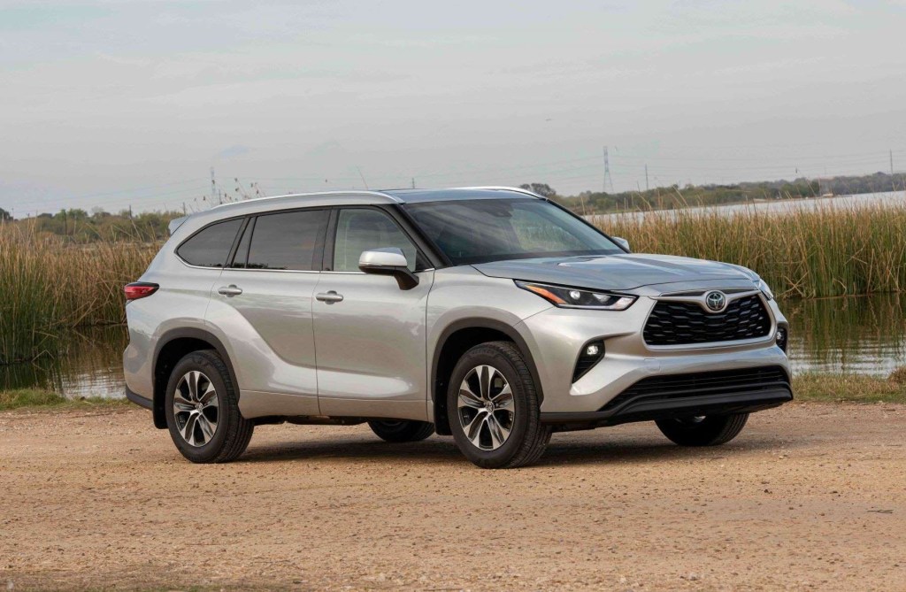 Celestial Silver Metallic 2022 Toyota Highlander parked next to a marsh, what's new features, price, trims, and more.