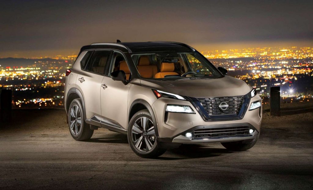 Champagne Silver Metallic 2022 Nissan Rogue with a city skyline in the background