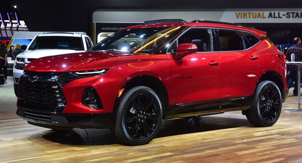 A red Chevrolet Blazer SUV is on display.