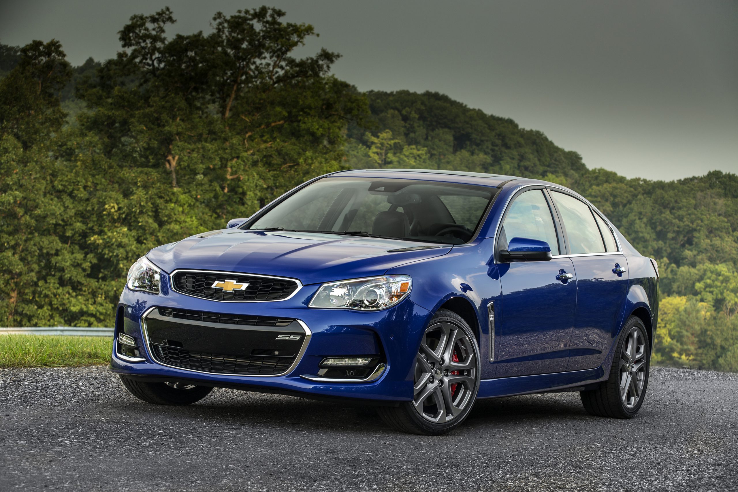 A Chevrolet SS, sold as the Holden Commodore in Australia, shot from the front 3/4 angle in blue.