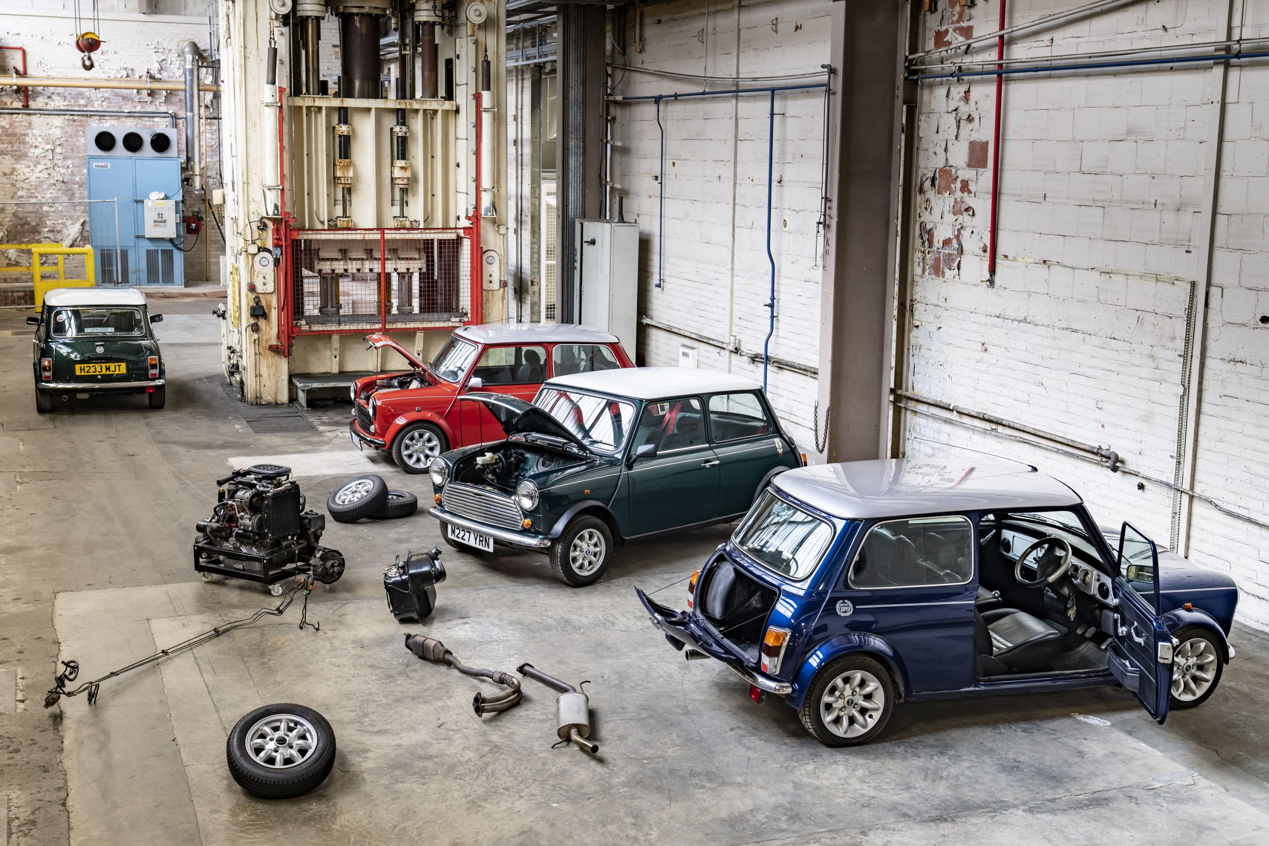 A trio of Mini Cooper EV conversions in the brand's workshops in the UK