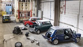 A trio of Mini Cooper EV conversions in the brand's workshops in the UK