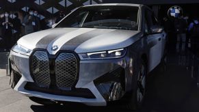 A Color-changing BMW in silver and black in front of a black and white background.