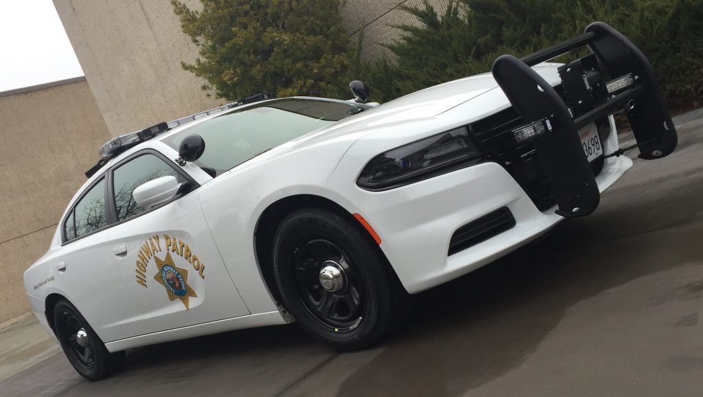 Marked Dodge Charger Pursuit with spotlights and "bull bar" unmarked police car | Stellantis