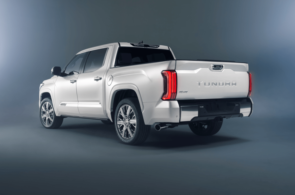 Driver's side rear angle view of Wind Chill Pearl 2022 Toyota Tundra Capstone