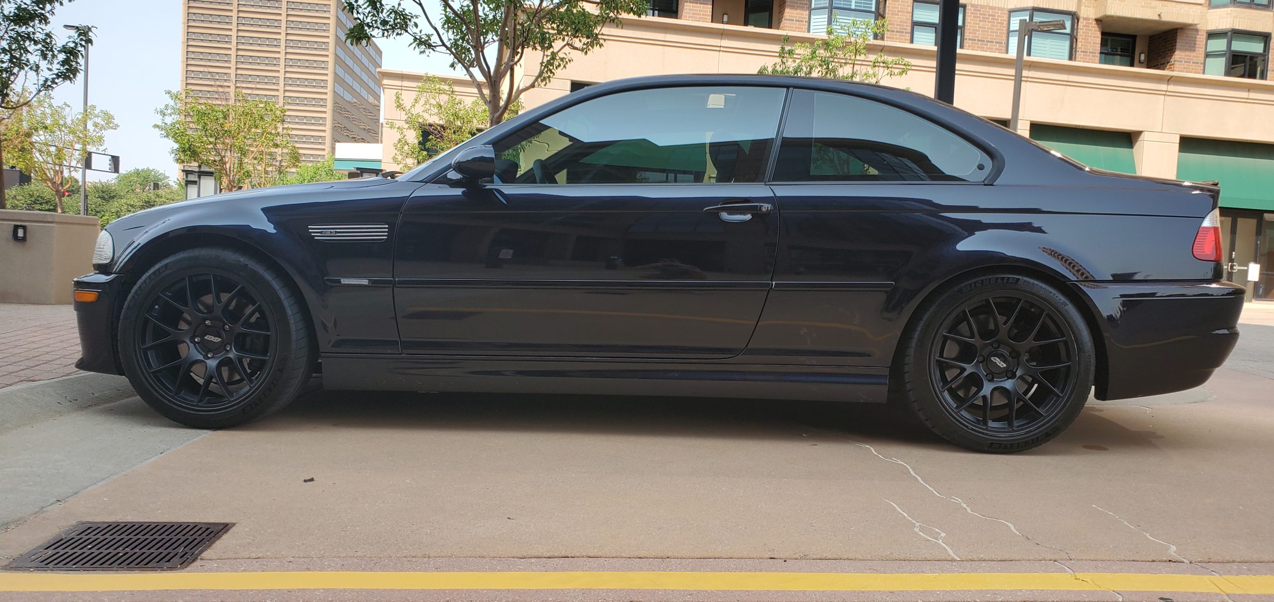 A black E46 BMW M3 shot in profile