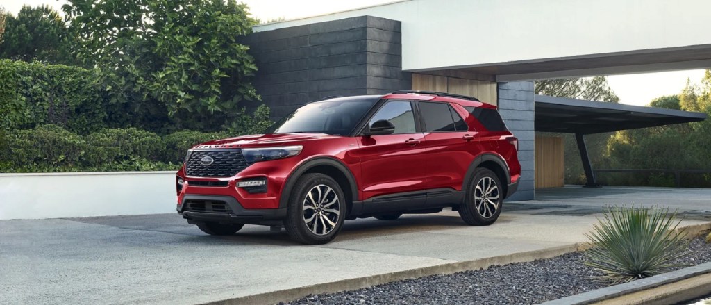 A red 2022 Ford Explorer parked in a driveway.