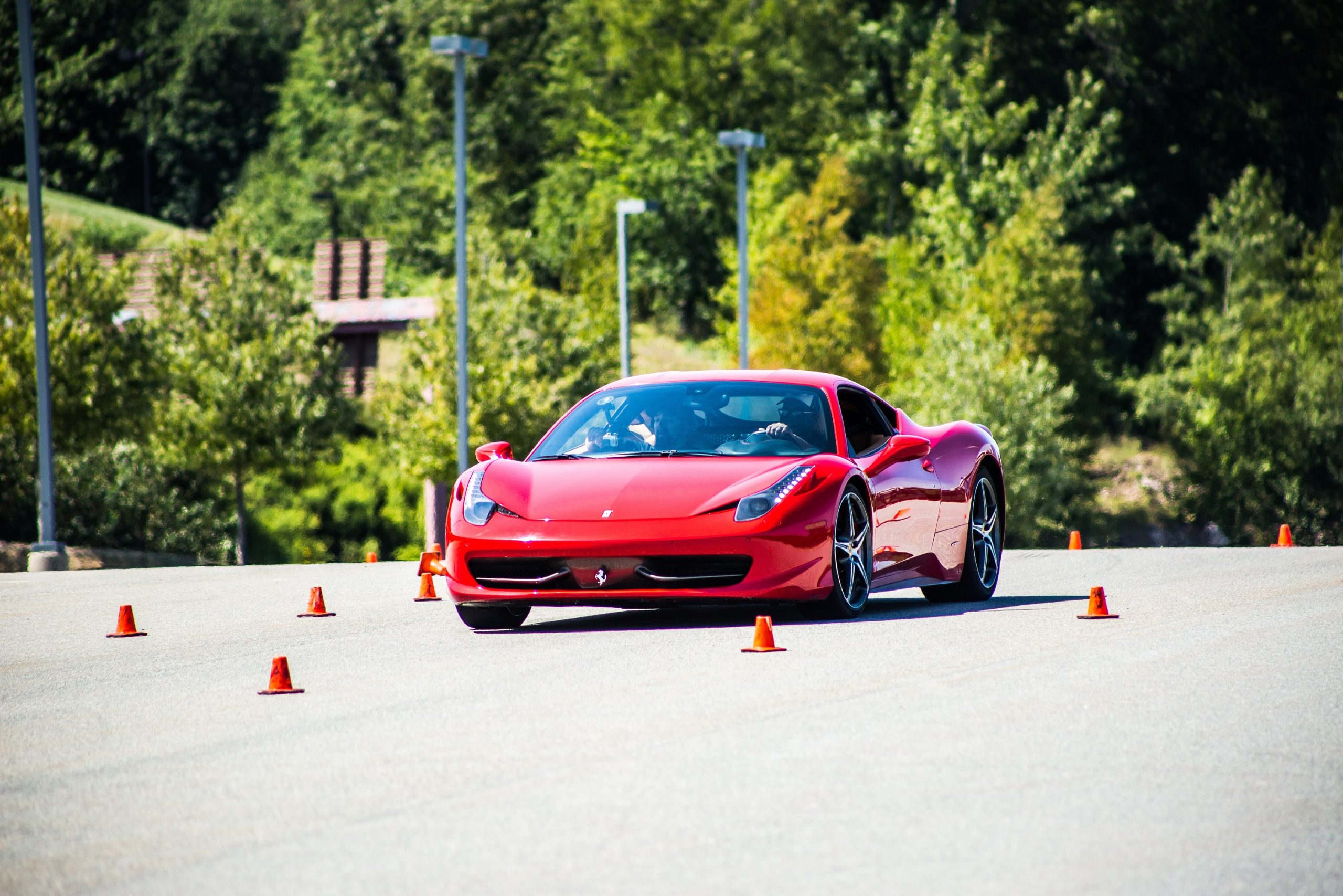 A red Ferrari 458 Italia on an autocross course, shot from the front 3/4
