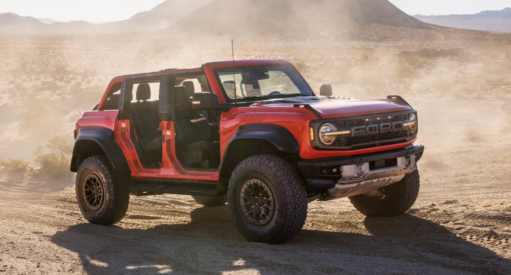 A red 2022 Ford Bronco Raptor is parked.