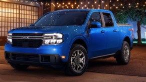 A blue 2022 Ford Maverick is parked outside.