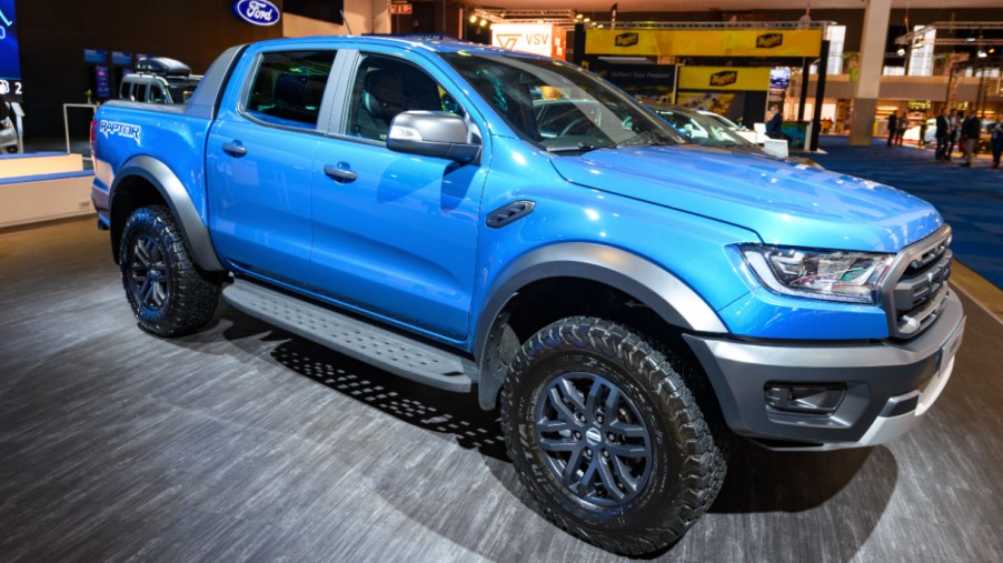 A blue Ford Ranger is on display.