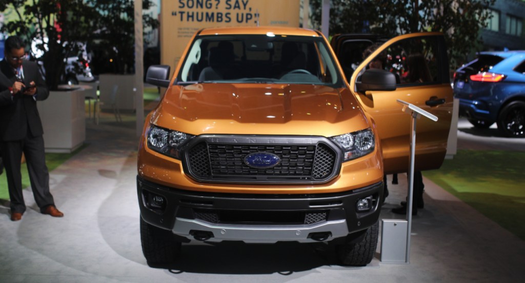 A copper Ford Ranger compact pickup truck is on display.