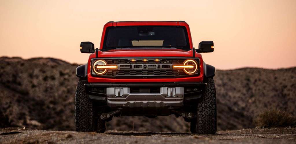 Front view of orange 2022 Ford Bronco Raptor, dealers markups are prioritized over reservation holders