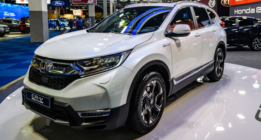 A white 2022 Honda CR-V Hybrid SUV is on display. 