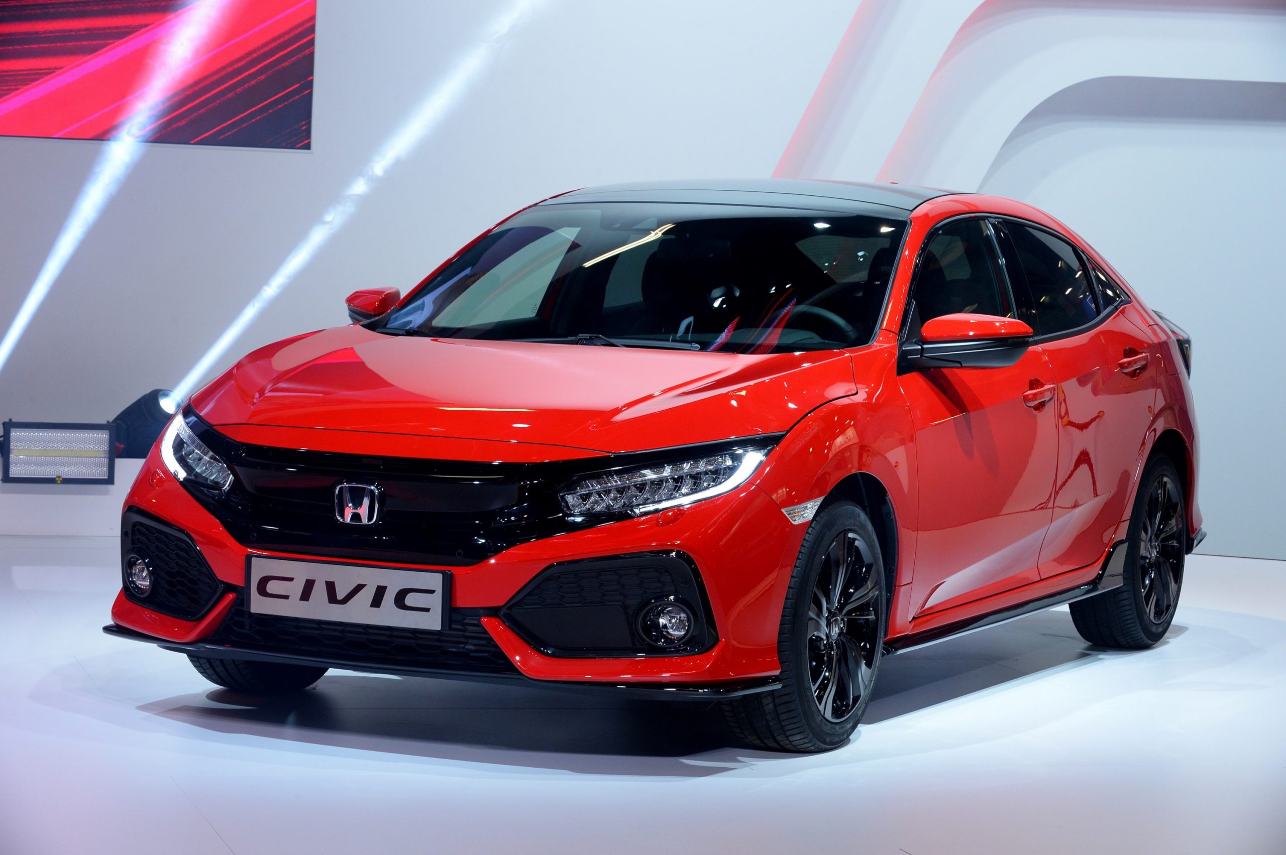 A red Honda Civic, voted one of the best used cars for 2022, seen here in a photo booth